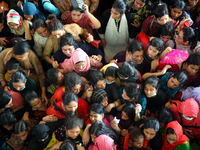 People queue to buy advance tickets for Eid train trips at Dhaka's Kamalapur Railway Station on Sunday, Apr 24, 2022. Tickets are being sold...