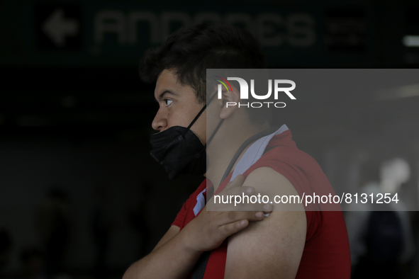 A person with sore arm inside the Constitutción de 1917 metro station in Mexico City, after receiving the biological AstraZeneca. 