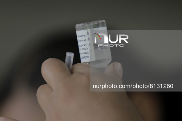 A nurse loads a syringe in a vaccination unit at the Constitución de 1917 metro station in Mexico City, where the AstraZeneca biological is...