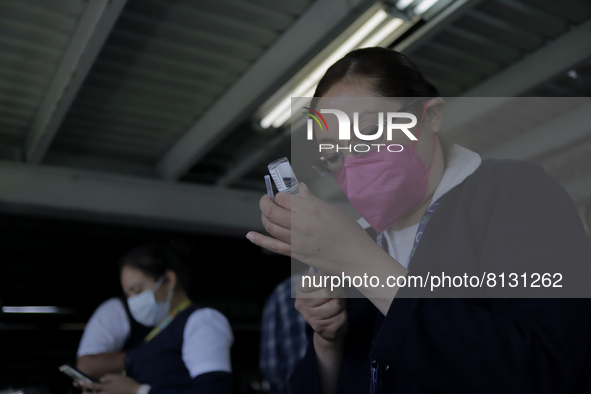 A nurse loads a syringe in a vaccination unit at the Constitución de 1917 metro station in Mexico City, where the AstraZeneca biological is...