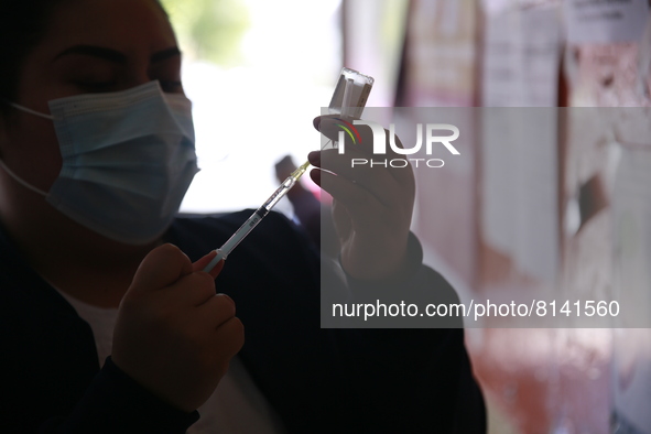 A nurse prepares a Covid-19 dose during a vaccination program in the local markets as attempt to reduce risk of contagion. On April 27, 2022...