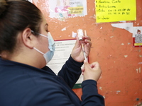 A nurse prepares a Covid-19 dose during a vaccination program in the local markets as attempt to reduce risk of contagion. On April 27, 2022...