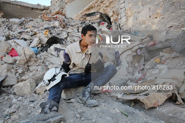 Malik Sabag a 15-year-old Syrian civil defense, Sitting in the street for Malik is kind of rest in neighborhood  of Bab alnairab of Aleppo d...