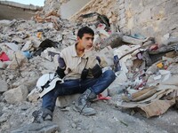 Malik Sabag a 15-year-old Syrian civil defense, Sitting in the street for Malik is kind of rest in neighborhood  of Bab alnairab of Aleppo d...