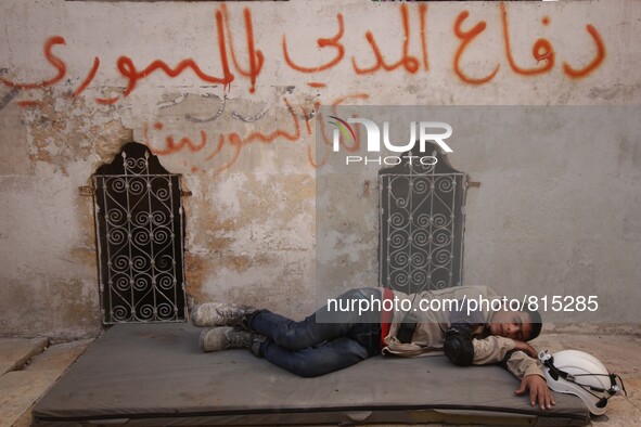 Malik Sabag a 15-year-old Syrian civil defense, Malik is Having some break time in the civil defense center at Bab al-nairab neighborhood di...