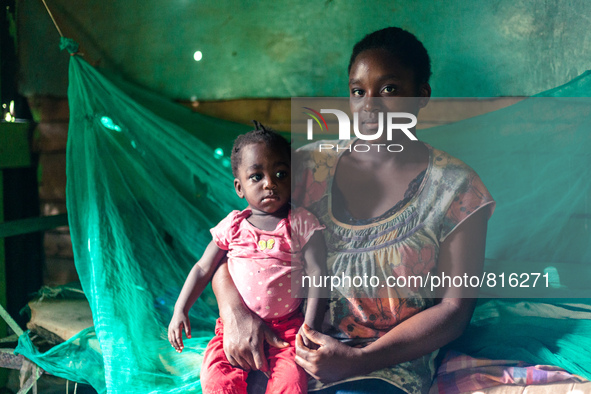 Portrait of haitian migrants  woman with her son in the Dominican Republic.
Thousands of descendants of haitian migrants in the Dominican R...