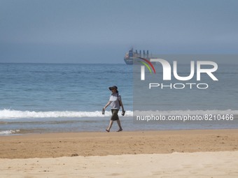 A person is seen performing outdoor activities on the coastline of Carcavelos Beach. Lisbon, May 09, 2022. Two months after the lifting of t...