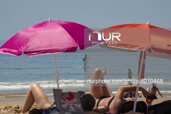 People are seen performing outdoor activities on the coastline of Carcavelos Beach. Lisbon, May 09, 2022. Two months after the lifting of th...