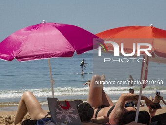 People are seen performing outdoor activities on the coastline of Carcavelos Beach. Lisbon, May 09, 2022. Two months after the lifting of th...