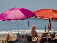 People are seen performing outdoor activities on the coastline of Carcavelos Beach. Lisbon, May 09, 2022. Two months after the lifting of th...