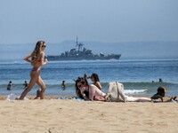 People are seen performing outdoor activities on the coastline of Carcavelos Beach. Lisbon, May 09, 2022. Two months after the lifting of th...