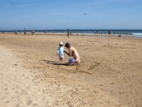 People are seen performing outdoor activities on the coastline of Carcavelos Beach. Lisbon, May 09, 2022. Two months after the lifting of th...