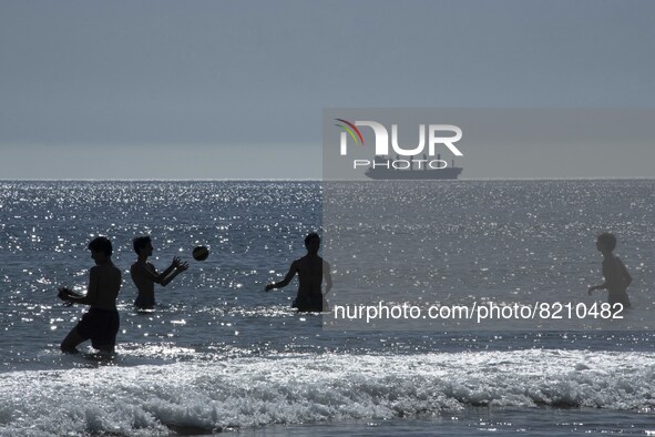 People are seen performing outdoor activities on the coastline of Carcavelos Beach. Lisbon, May 09, 2022. Two months after the lifting of th...