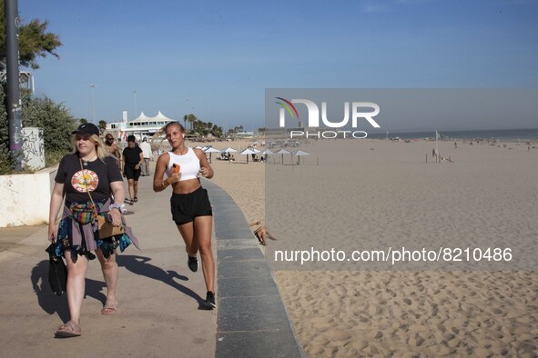 People are seen performing outdoor activities on the coastline of Carcavelos Beach. Lisbon, May 09, 2022. Two months after the lifting of th...