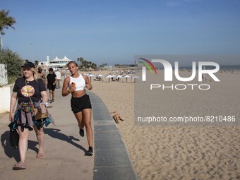 People are seen performing outdoor activities on the coastline of Carcavelos Beach. Lisbon, May 09, 2022. Two months after the lifting of th...