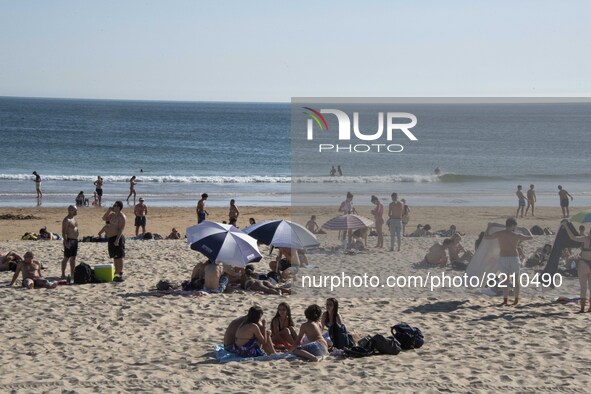 People are seen performing outdoor activities on the coastline of Carcavelos Beach. Lisbon, May 09, 2022. Two months after the lifting of th...