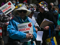 Health-care workers, activists and their supporters protest against Premier Kenney and the UCP government that are taking steps to privatize...