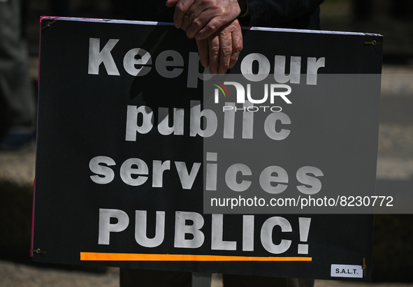 A protester holds a placard with words 'Keep our public services PUBLIC!'.
Health-care workers, activists and their supporters protested thi...