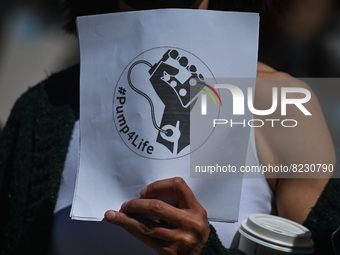 A protester holds a placard with words '#Pump4Life'.
Health-care workers, activists and their supporters protested this afternoon during 'Ra...