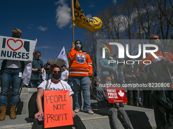 Health-care workers, activists and their supporters protest against Premier Kenney and the UCP government that are taking steps to privatize...