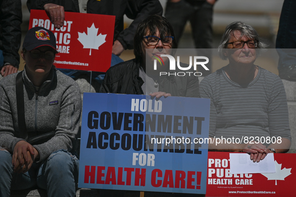 Health-care workers, activists and their supporters protest against Premier Kenney and the UCP government that are taking steps to privatize...