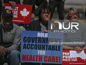 Health-care workers, activists and their supporters protest against Premier Kenney and the UCP government that are taking steps to privatize...