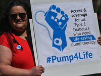 A protester holds a placard with words '#Pump4Life'.
Health-care workers, activists and their supporters protested this afternoon during 'Ra...