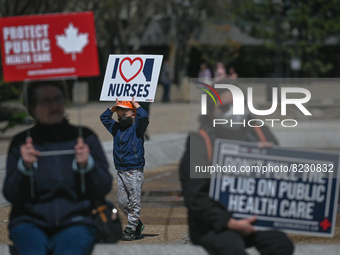 Health-care workers, activists and their supporters protest against Premier Kenney and the UCP government that are taking steps to privatize...