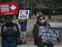 Health-care workers, activists and their supporters protest against Premier Kenney and the UCP government that are taking steps to privatize...