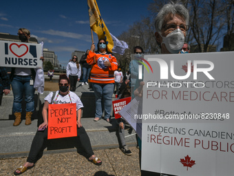 Health-care workers, activists and their supporters protest against Premier Kenney and the UCP government that are taking steps to privatize...