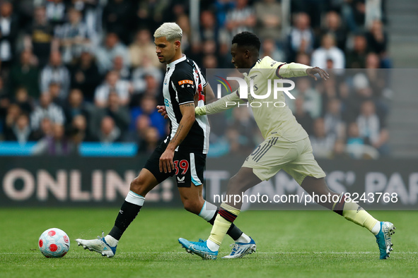 Burno Guimaraes of Newcastle United and Nuno Tavares of Arsenal in action during the Premier League match between Newcastle United and Arsen...