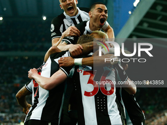 Callum Wilson of Newcastle United celebrates with teammates after scoring their sides first goal during the Premier League match between New...