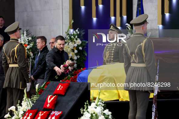 President of Ukraine Volodymyr Zelensky lays flowers near the coffin with the body of Leonid Kravchuk in Kyiv, Ukraine, May 17, 2022. Dozens...