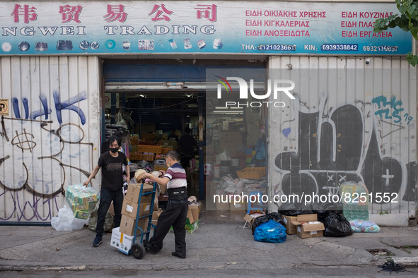 People are working outside a store in Athens, Greece on May 18, 2022. A committee of experts from the Health Ministry are examining the poss...