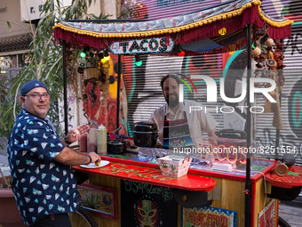 A man selling tacos is posing for a photo in Athens, Greece on May 18, 2022. A committee of experts from the Health Ministry are examining t...