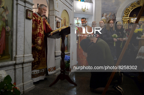 KYIV, UKRAINE - MAY 18, 2022 - A priest conducts a funeral service of 95th Separate Air Assault Brigade officer, Lt Denys Antipov who perish...