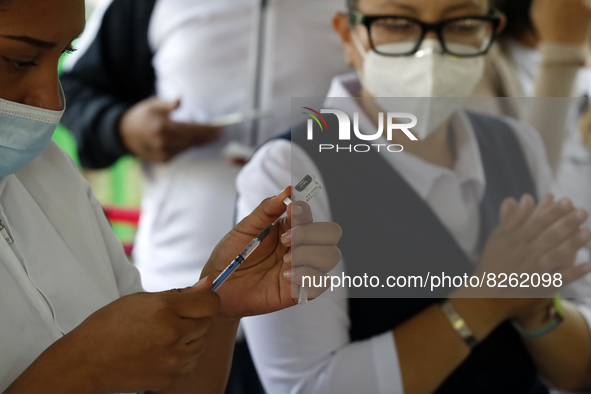 A nurse prepares the first dose of Covid19 Pfizer vaccine during mass vaccination campaign for infants 12 to 14 years of age, without comorb...