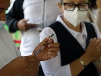 A nurse prepares the first dose of Covid19 Pfizer vaccine during mass vaccination campaign for infants 12 to 14 years of age, without comorb...