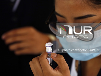 A nurse prepares the first dose of Covid19 Pfizer vaccine during mass vaccination campaign for infants 12 to 14 years of age, without comorb...