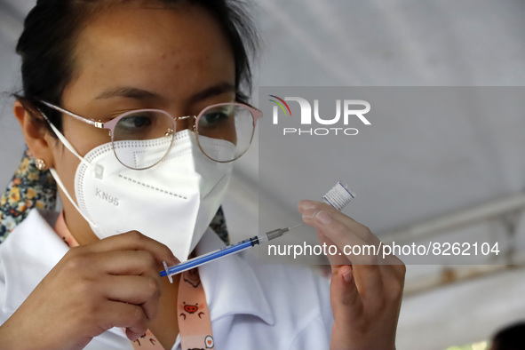 A nurse prepares the first dose of Covid19 Pfizer vaccine during mass vaccination campaign for infants 12 to 14 years of age, without comorb...