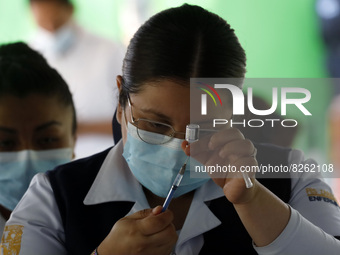 A nurse prepares the first dose of Covid19 Pfizer vaccine during mass vaccination campaign for infants 12 to 14 years of age, without comorb...