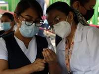 A nurse prepares the first dose of Covid19 Pfizer vaccine during mass vaccination campaign for infants 12 to 14 years of age, without comorb...