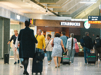 passengers are seen at Cologne & Bonn airport on May 25, 2022 as Germany will ease its travel restriction from June 1 during the summer holi...