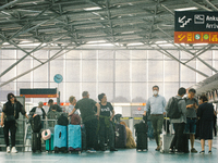 passengers are seen at Cologne & Bonn airport on May 25, 2022 as Germany will ease its travel restriction from June 1 during the summer holi...