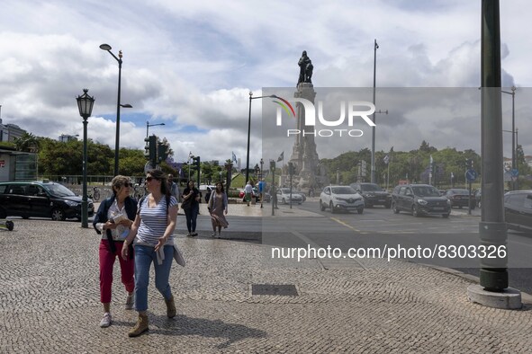 People are seen walking near the Marques de Pombal monument. Lisbon, May 23, 2022. The European Centre for Disease Prevention and Control (E...