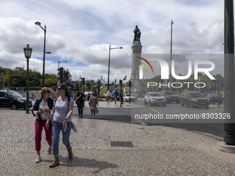 People are seen walking near the Marques de Pombal monument. Lisbon, May 23, 2022. The European Centre for Disease Prevention and Control (E...