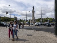 People are seen walking near the Marques de Pombal monument. Lisbon, May 23, 2022. The European Centre for Disease Prevention and Control (E...