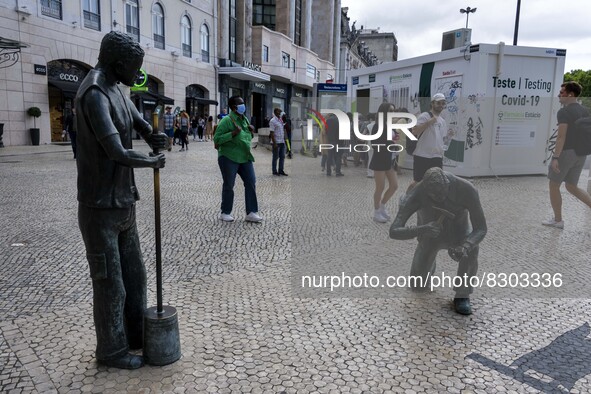 People are seen lining up to wait for a COVID-19 test at a stand located on Liberdade Avenue. Lisbon, May 23, 2022. The European Centre for...