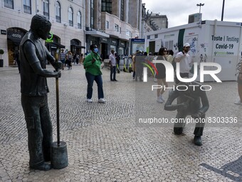 People are seen lining up to wait for a COVID-19 test at a stand located on Liberdade Avenue. Lisbon, May 23, 2022. The European Centre for...