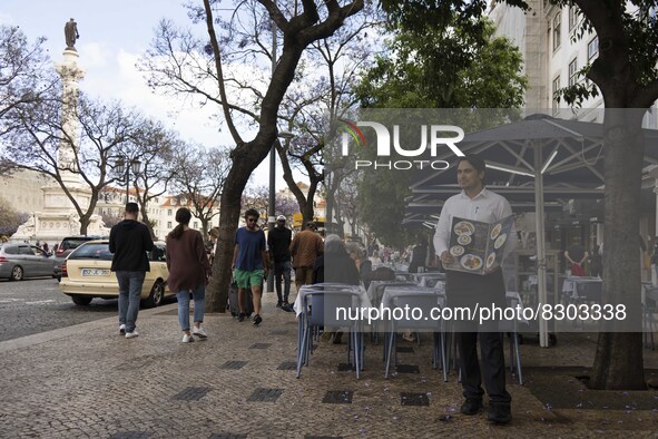 A waiter stands near a restaurant area located in front of Rossio square. Lisbon, May 23, 2022. The European Centre for Disease Prevention a...